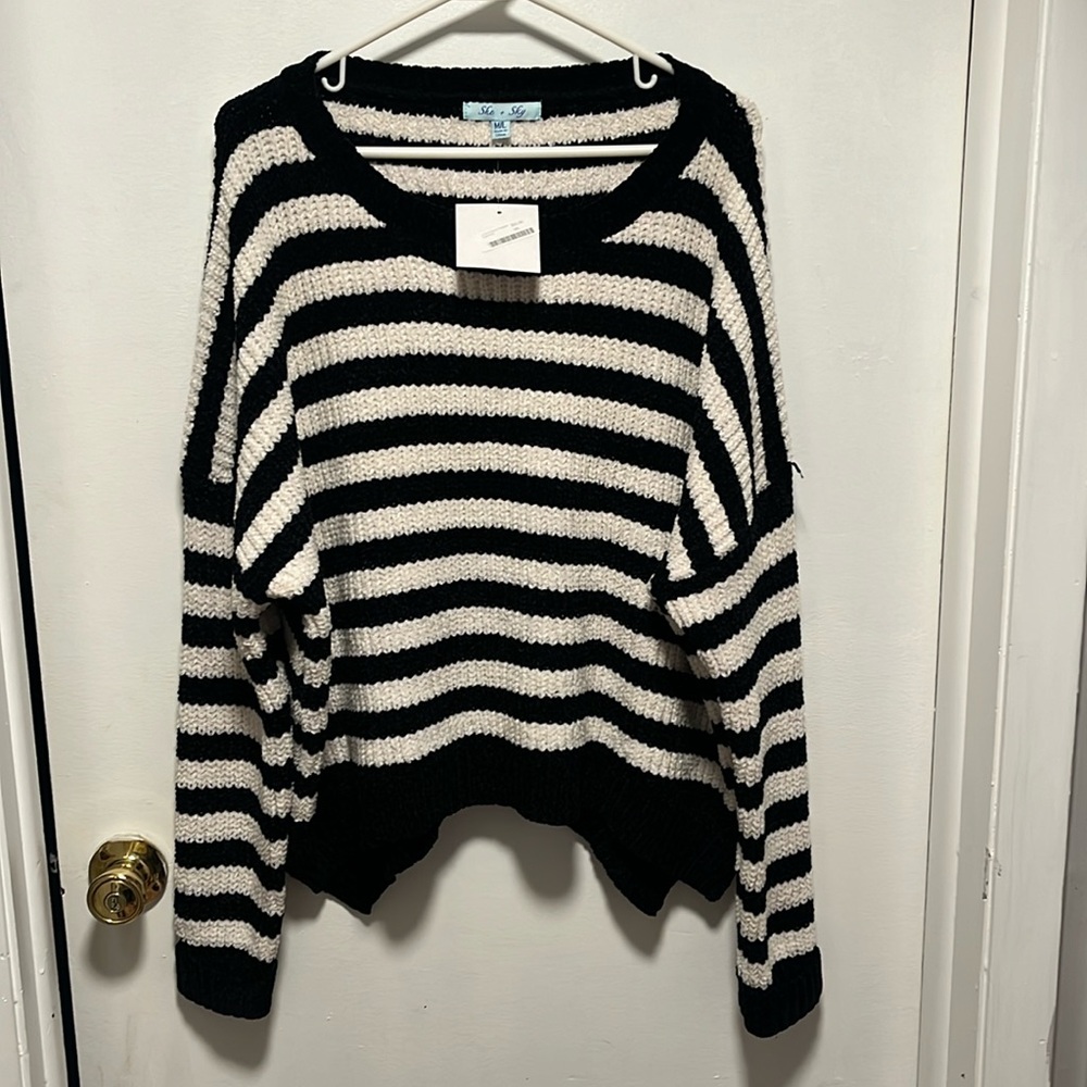 Brand new, with tags, extra soft black and white striped sweater.